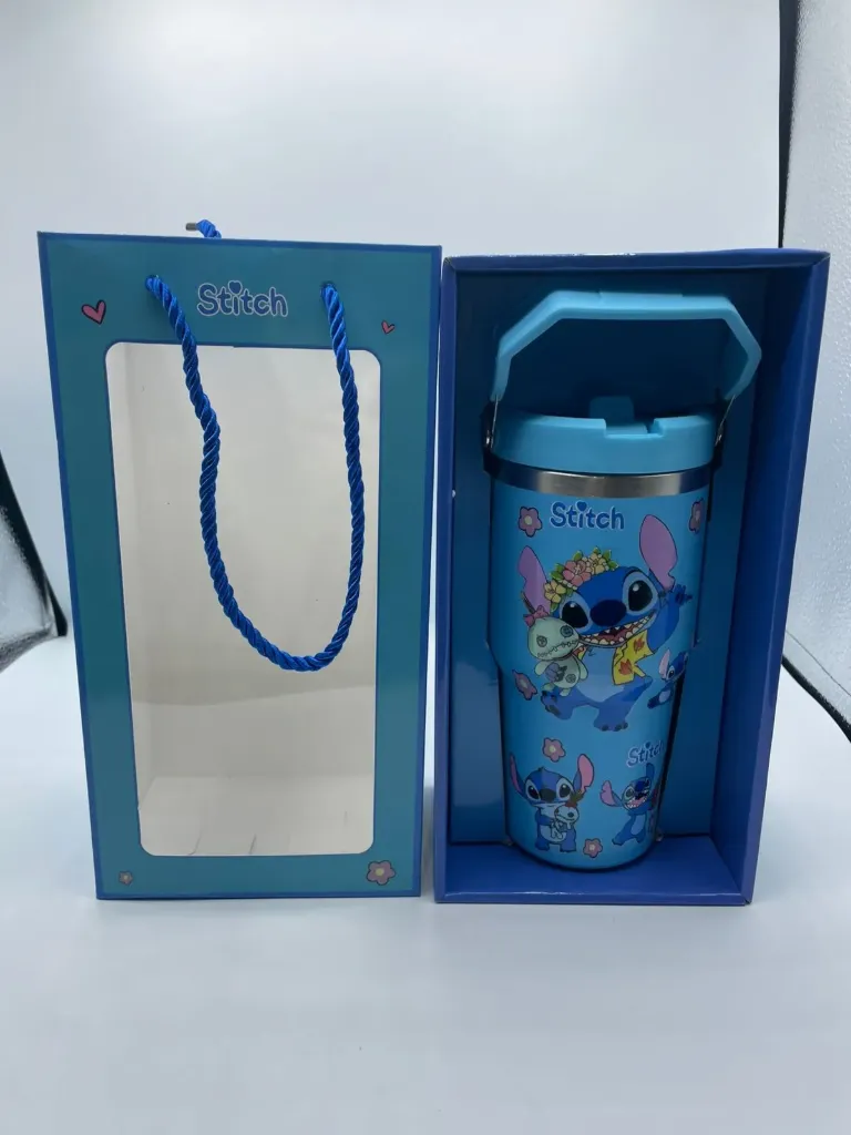 Stitch insulated stainless steel tumbler, 900ml (30oz), with a handle and lid.