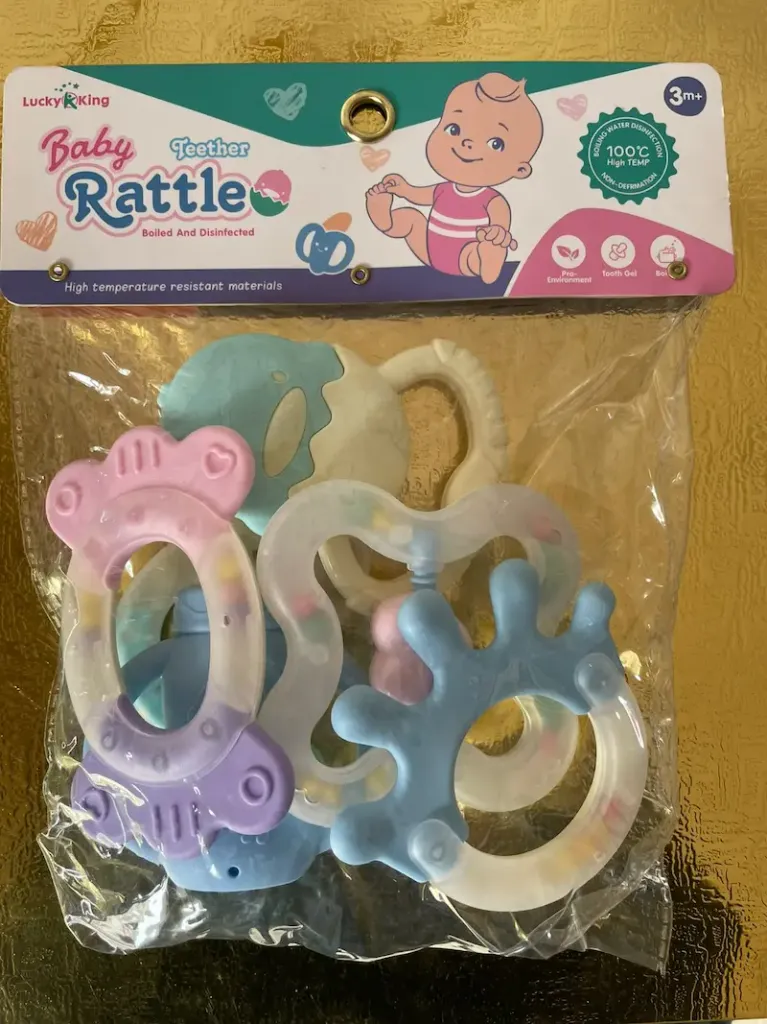 Baby teether and rattle set designed for infants 3 months and older.