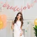 Bride-to-be party decoration set, includes a sash, banner, and headband for bachelorette parties.