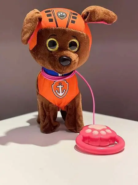 Paw Patrol Zuma interactive plush toy with a leash-controlled remote. interactive dog that can walk, bark, sing songs, and even dance or wag its tail when activated.