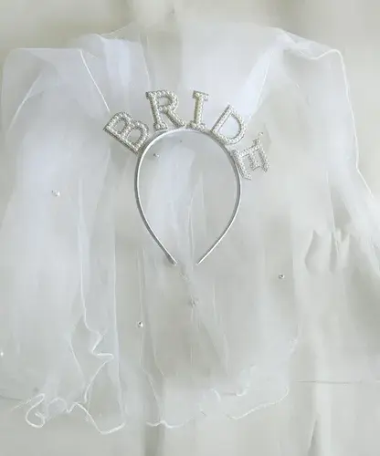 Bride headband  artificial pearls silver lettering and a white tulle veil.