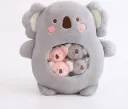 Cute grey koala plush pillow with a transparent window holding 4 removable mini koala toys inside