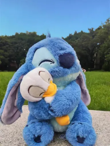 stitch plush holding duck